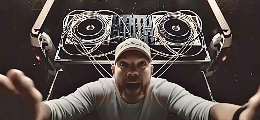 PATE — Houston artist looking up from behind DJ decks